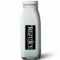 Bm · Young Thai coconut water, young Thai coconut meat, blue spirulina. (16 oz. pictured)
