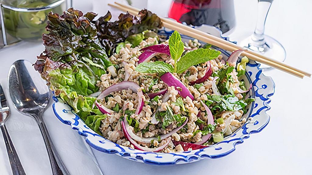 Larb · With mint leaves, onions and cilantro. in a chili-lime dressing and fish sauce.. Your choice of ground pork,. chicken, beef or tofu