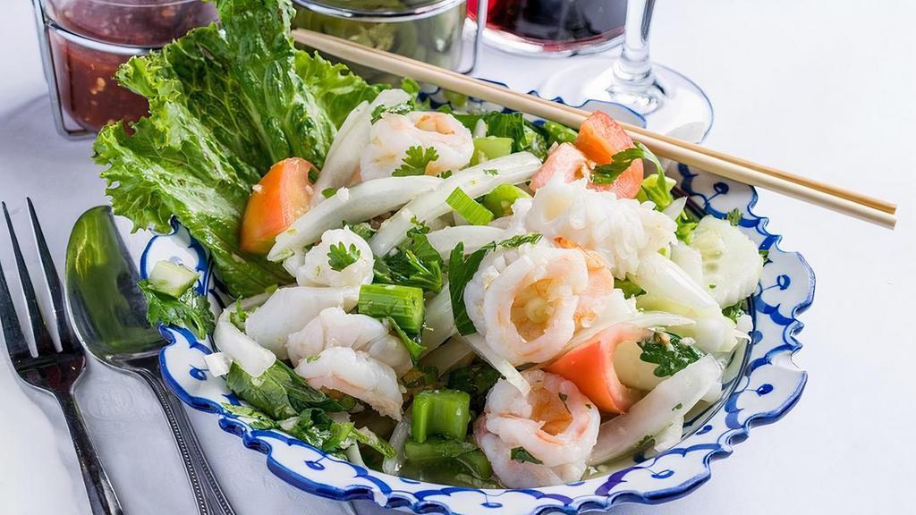 Seafood Medley Salad · Combination of prawns, calamari,. layered in with fresh cucumber, onions,. tomatoes, celery, cilantro and drizzled. with lime juice and fish sauce