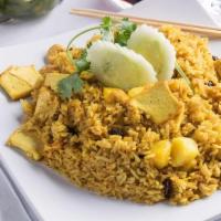 Pineapple Fried Rice (L) · Wok fried with egg, cashew nuts, raisins and fresh pineapple