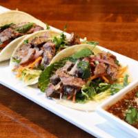 Mtk Beef Taco · New. Thai beef Num Tok is thin sliced grilled beef that is mixed with cilantro, mint, onions...
