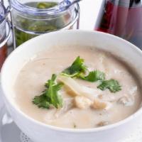 Tom Ka · Creamy coconut soup with Thai herbs,. onions, mushrooms and cilantro