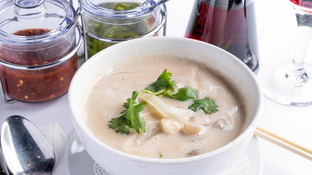 Tom Ka · Creamy coconut soup with Thai herbs,. onions, mushrooms and cilantro
