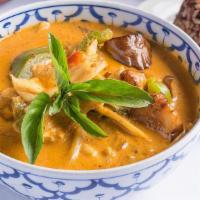 Red Curry · Eggplant, bamboo shoots, bell peppers and sweet basil leaves. Simmered in red curry and coco...