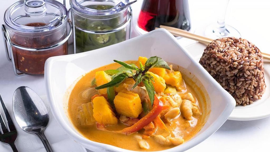 Pumpkin Curry · Pumpkin, carrots, bell peppers and sweet basil. Simmered in red curry and coconut milk