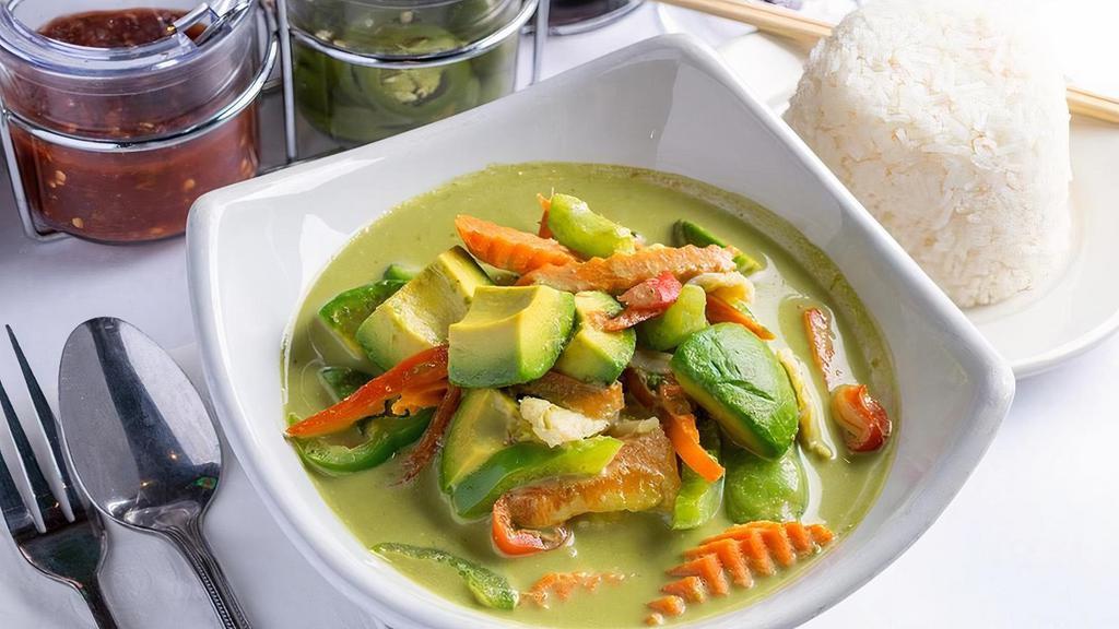 Avocado Curry · Avocado, bell peppers, carrots and snow peas. Simmered in creamy green curry and coconut milk