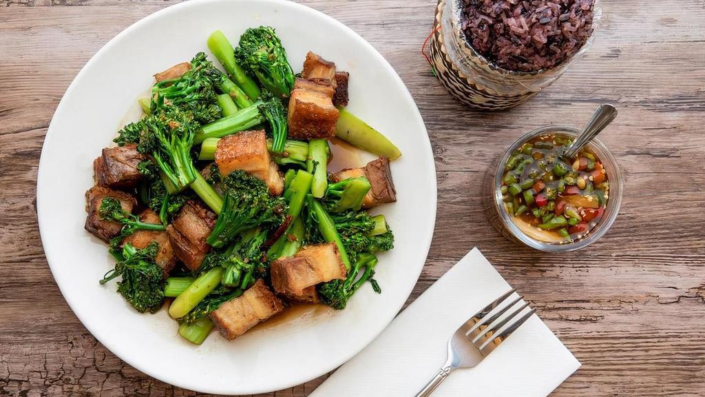Crispy Pork Belly · Our crispy pork belly is homemade here at. MTK daily. Comes with crunchy broccolini. in house sauce. Your choice of rice