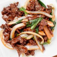 Mongolian Beef · Served with brown sauce and vegetables.