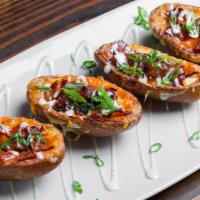 Loaded Potato Skins · 4 Half Potato Skins, Pepper Jack and Cheddar Cheese Mix, Candied Bacon, Green Onions and Ranch
