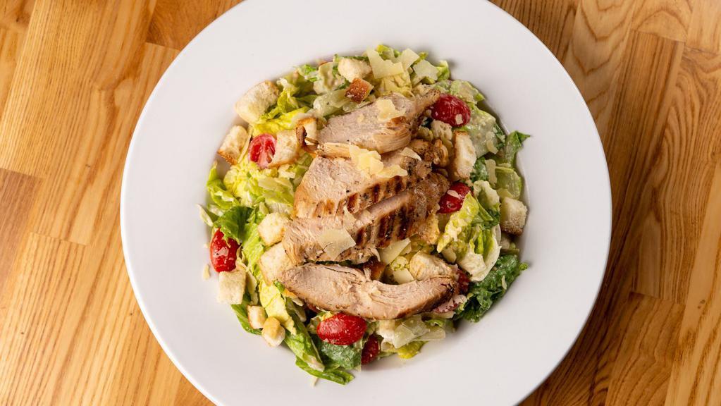 Fire-Grilled Chicken Caesar Salad · Chopped Romaine Hearts – Grilled Chicken – House Croutons – Sweet Grape Tomatoes – Parmigiano