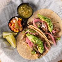 Fire-Grilled Tri-Tip Tacos · Avocado – Marinated Red Onions – Cilantro – Salsa – Served with Black Beans & Limes