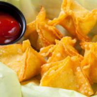 Crab Rangoon · Real crab mixed with cream cheese wrapped in rice paper, flash-fried