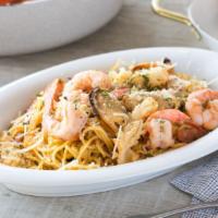 Seafood Garlic Noodles · Grilled shrimp, squid, mussels, sausages over garlic noodles