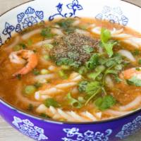 Seafood Udon · Flavorful thick broth, white udon-styled noodles with crab, krab, fish cakes, shrimp, and sq...
