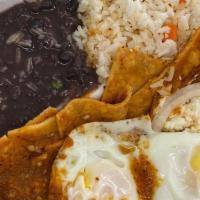 Chilaquiles Verdes Y Rojos · Fried corn tortilla chips with green or red sauce tomato with a side of egg.