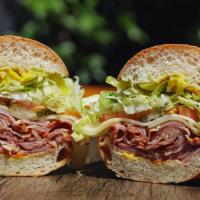 Hot Pastrami Sandwich · It’s getting hot in here! Our East Coast Hot Pastrami is served with Swiss Cheese, Banana Pe...