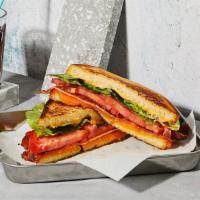 The Blt Sandwich · Melted Cheddar cheese with bacon, lettuce, tomato and mayonnaise grilled between two slices ...