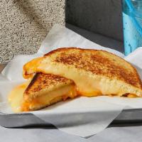 Cheese On Cheese Grilled Cheese · Melted Cheddar, Swiss, and Jack cheeses grilled between two slices of buttered bread.