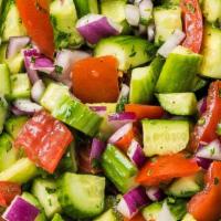 Cucumber Tomato Salad · Sliced Cherry Tomatoes, chopped Cucumbers, Red Onions, Lemon Juice, and Italian Dressing.