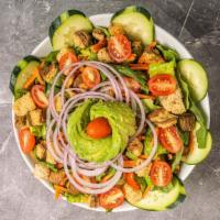 Avocado Romaine Salad · Romaine, mixed greens, cucumber, tomato, carrot, red onion and croutons tossed in citrus vin...