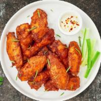 Chicken Wings · Fresh chicken wings breaded and fried until golden brown. Served with a side fries and your ...