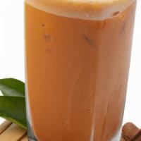 Thai Milk Tea · Our strong-brewed Thai black tea is combined with spices such as star anise, crushed tamarin...
