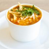 Tortilla Soup · Soup made with fried corn tortilla and seasoned tomato broth.