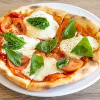 Margarita Pizza · Pizza sauce, fresh mozzarella cheese, pecorino cheese, dried oregano, fresh basil leaves.