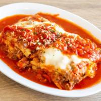 Meat Lasagna · Ground meat, marinara sauce, ricotta cheese, mozzarella cheese, Parmesan cheese.