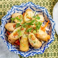 Egg Rolls · Crispy rolls stuffed with marinated mung bean silver noodle, tofu, cabbage and carrots; serv...