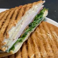 Classic Turkey · Grilled Panini Bread, Turkey, Provolone Cheese, Arugula, Tomato, Mayo