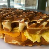 Bacon & Eggs · Fresh Waffles, Scrambled Eggs, Bacon, Cheddar Cheese, Side of Ketchup