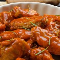 Mango Habanero Chicken Wings · Fresh chicken wings prepared with our house made mango habanero marinade and served with a s...