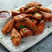 Bbq Chicken Wings · Fresh chicken wings doused in flavorful BBQ sauce and served with a side of ranch dressing.