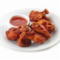 Sweet & Spicy Chili Chicken Wings · Fresh chicken wings prepared with house made sweet and spicy chili marinade and served with ...