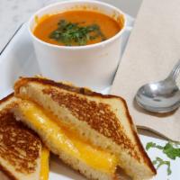 Grilled Cheese & Tomato Soup · Soft brioche bread with aged, melted cheddar cheese. Served with tomato soup..