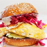 La Bomba · Two farm fresh fried eggs stacked with our house-made special sauces, filled with chicken an...
