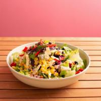 Baja Salad · Romaine, black beans, avocado, corn, tomato, onion, cilantro, tortilla strips, chipotle dres...
