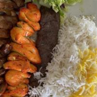 Lamb Sultani · Combination plate of a skewer of lamb filet and and a skewer of ground beef.