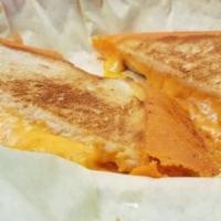Grilled Cheese Sammie · Delicious cheddar cheese on sourdough. Fries Included