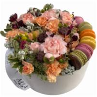 Blooms & Macarons · Seasonal colorful blooms and macarons arranged in a floral box. 
The image shown is for a la...