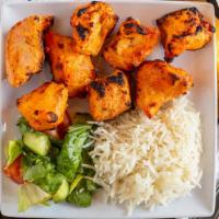 Chicken Tikka Boti Kebab · Chicken breast simmered in onion and tomato sauce with a blend of aromatic herbs, spices and...