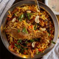 Chicken Biryani · Basmati rice flavored and cooked with Chicken in chef's special biryani Masala.