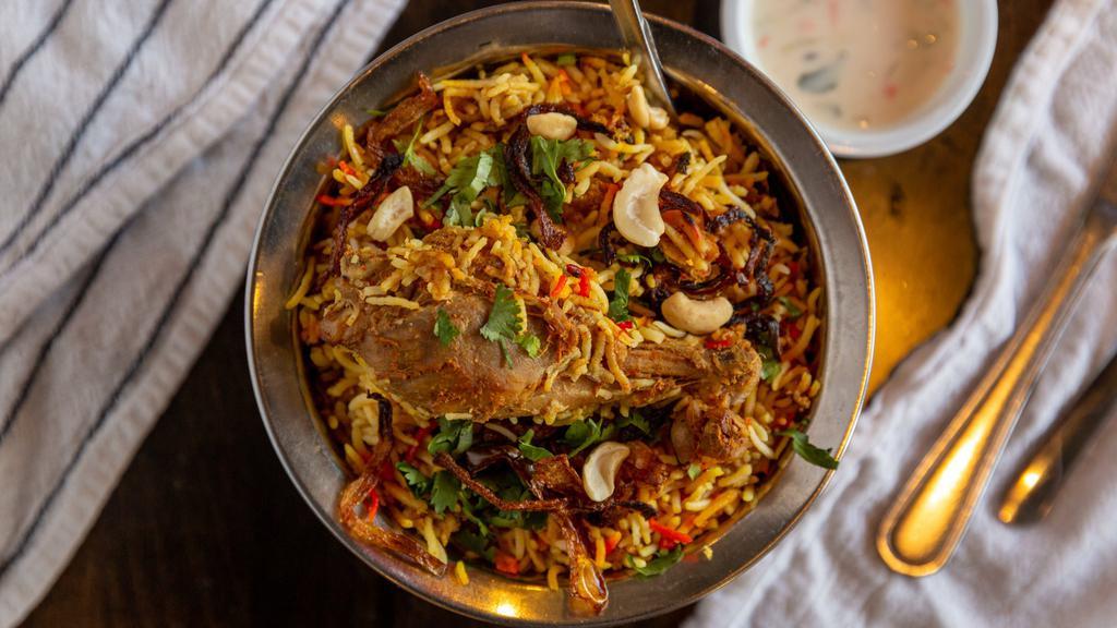Chicken Biryani · Basmati rice flavored and cooked with Chicken in chef's special biryani Masala.