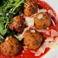 Meatballs In Harissa Tomato Sauce · A blend of grassfed beef and pork meatballs bathed in DiNapoli tomato sauce and topped with ...