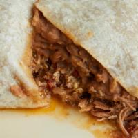 Machaca Burrito · Shredded beef with sautéed onions, tomatoes, Jalapeños, eggs, beans and melted cheddar cheese.