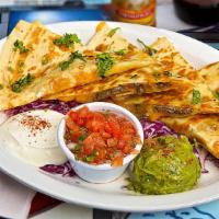 Loaded Quesadilla · Your protein choice, jack & cheddar mix, served with salsa, sour cream & guacamole.