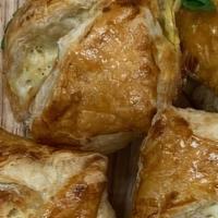 Small Khachapuri · Flaky light pastry filled with cheese and spices.