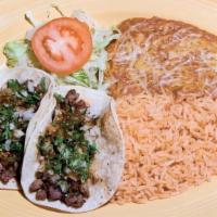 Taco Plate · Soft corn tortillas filled with your choice of meat, cilantro, onions, and salsa.