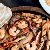 Mixed Fajita · Choice of any two (steak, chicken, or shrimp) with onions, bell peppers, and warm flour or c...